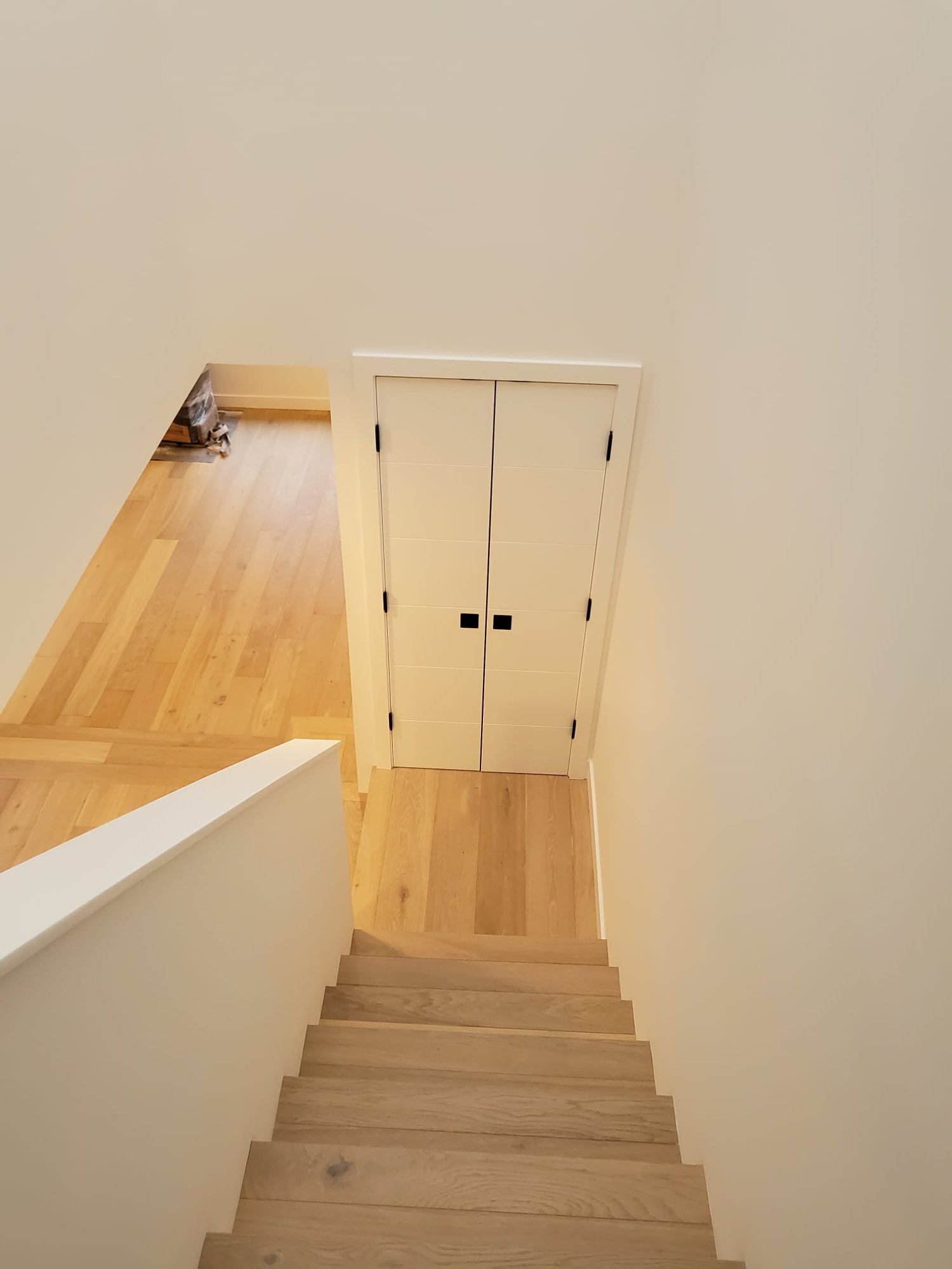 Open concept living room with custom stairs in Surrey