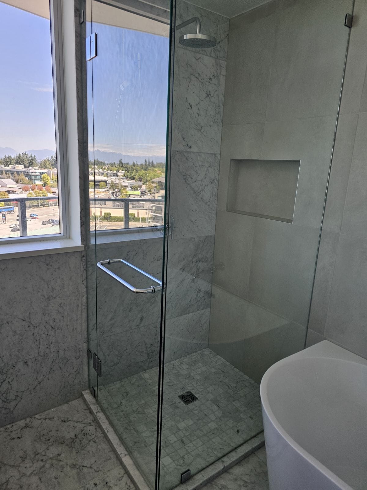 Spa-style marble master bathroom in Coquitlam